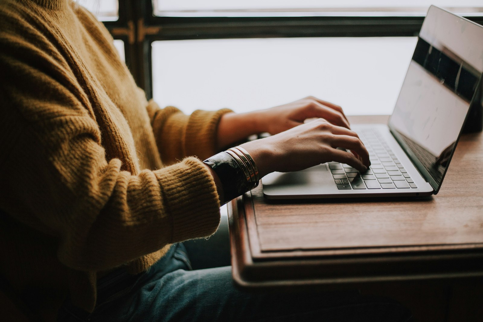 Sales rep working through an email outreach inbox on a laptop