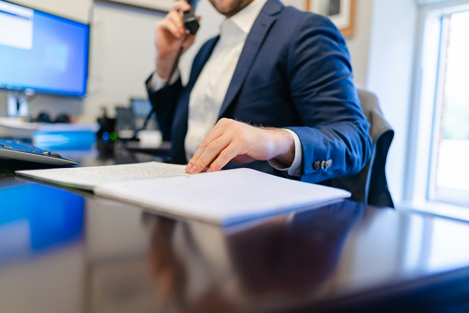Sales rep making a cold call at his desk